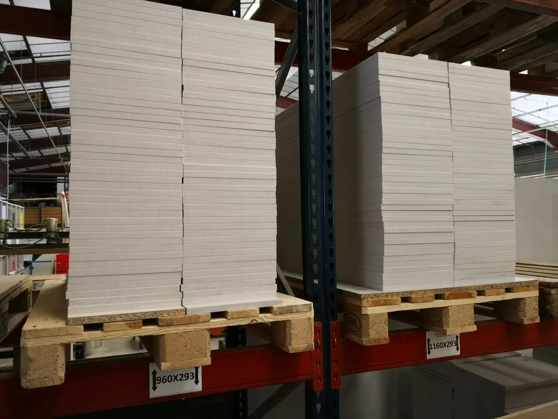 stack of wooden planks on brates