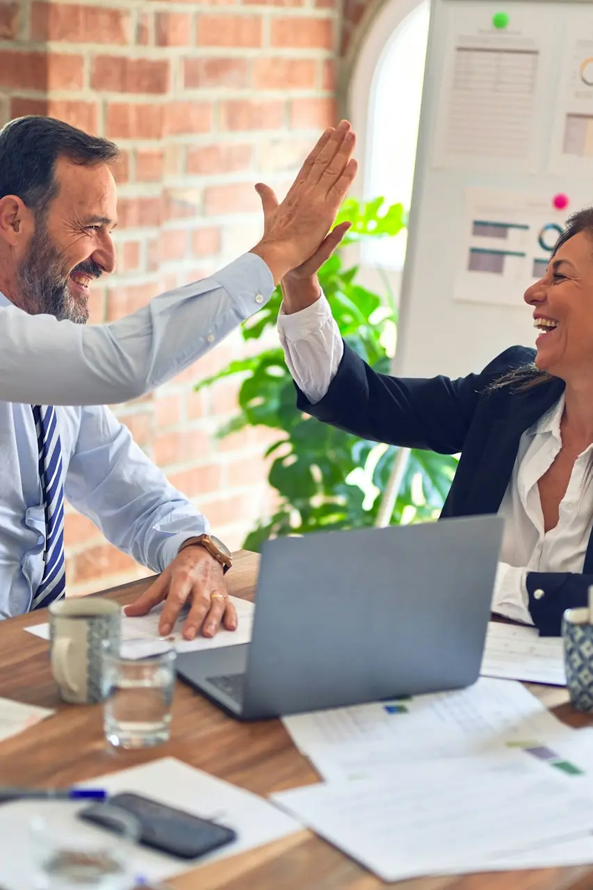 man in white dress shirt sitting beside woman in black long sleeve shirt