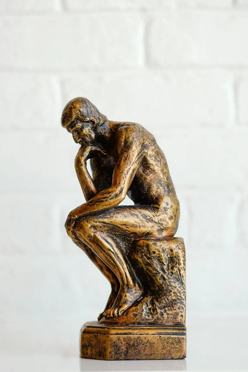 brown concrete statue of man