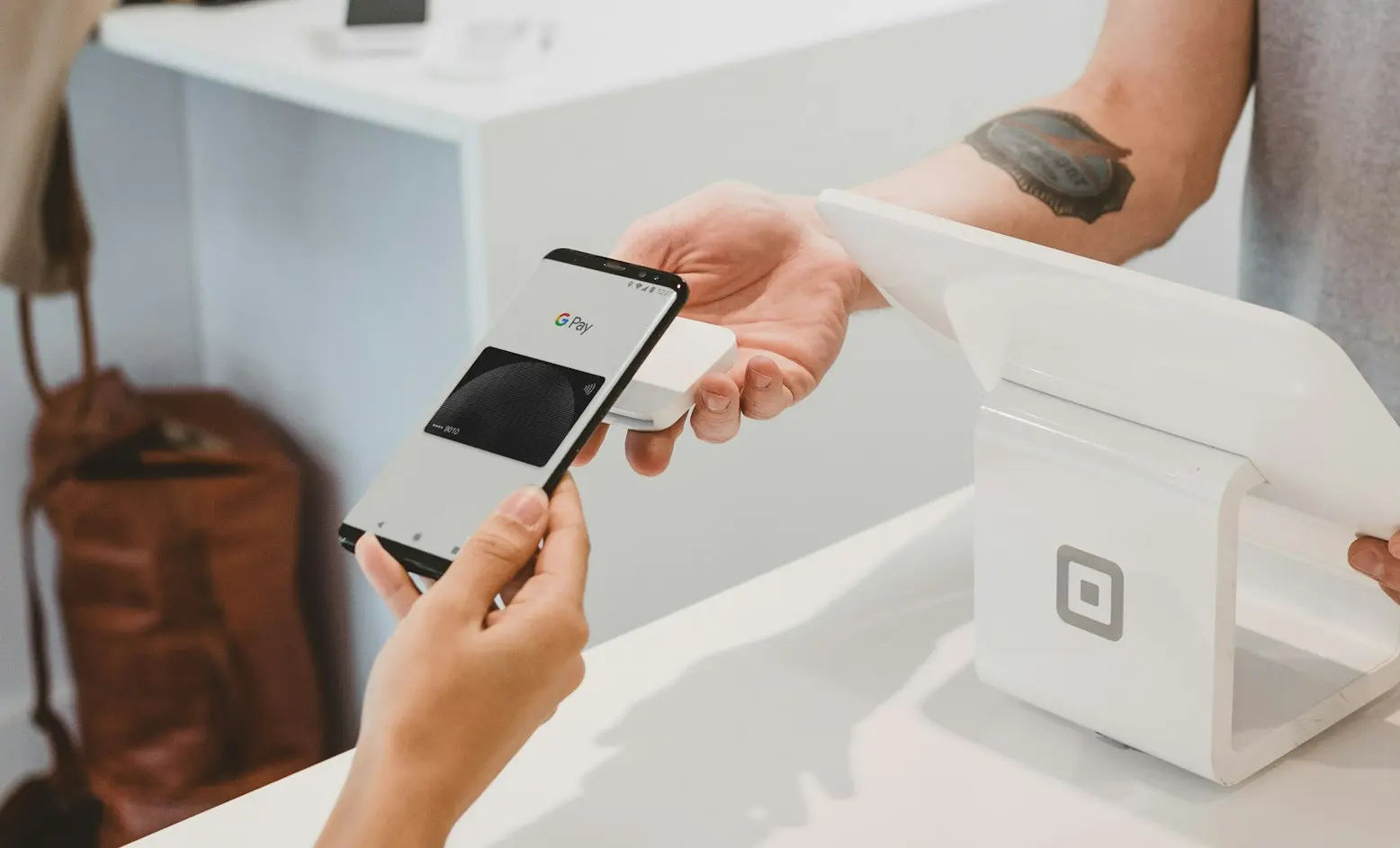 person holding black Android smartphone close-up photography