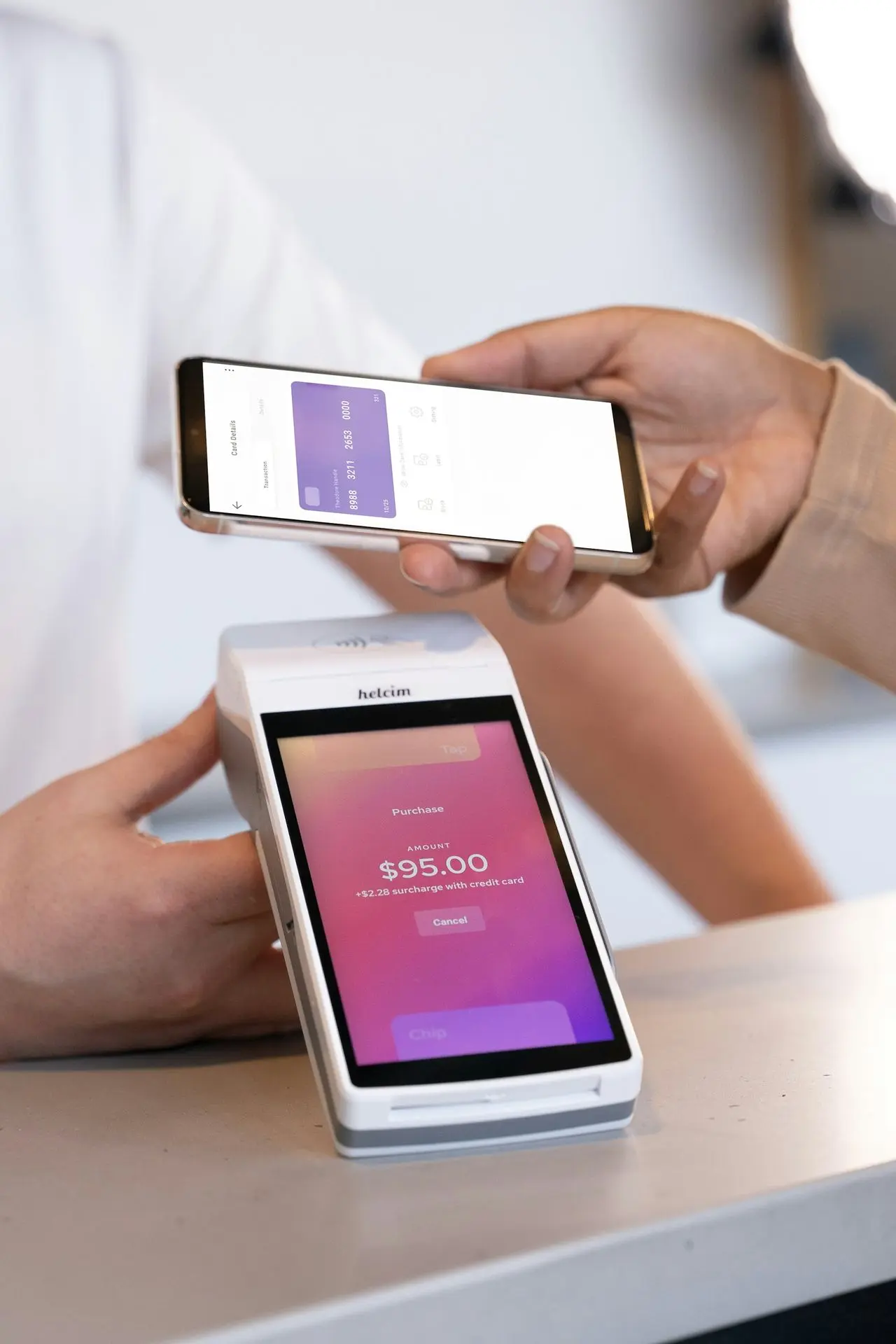 A person holding a cell phone in their hand